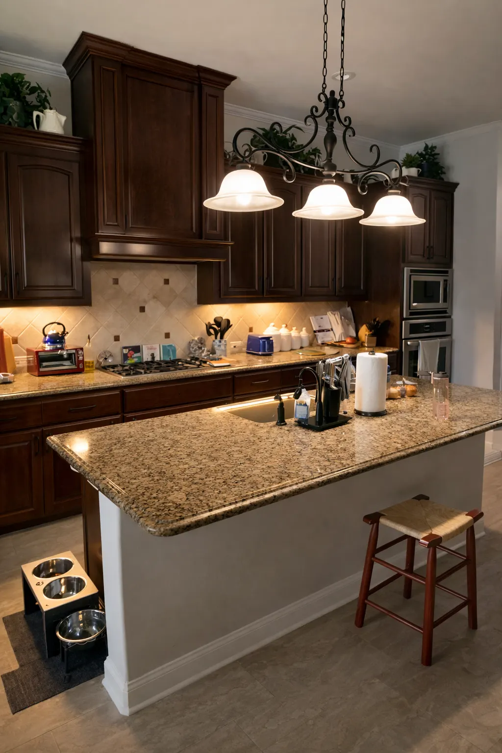 Kitchen remodel with granite island and pendant lighting