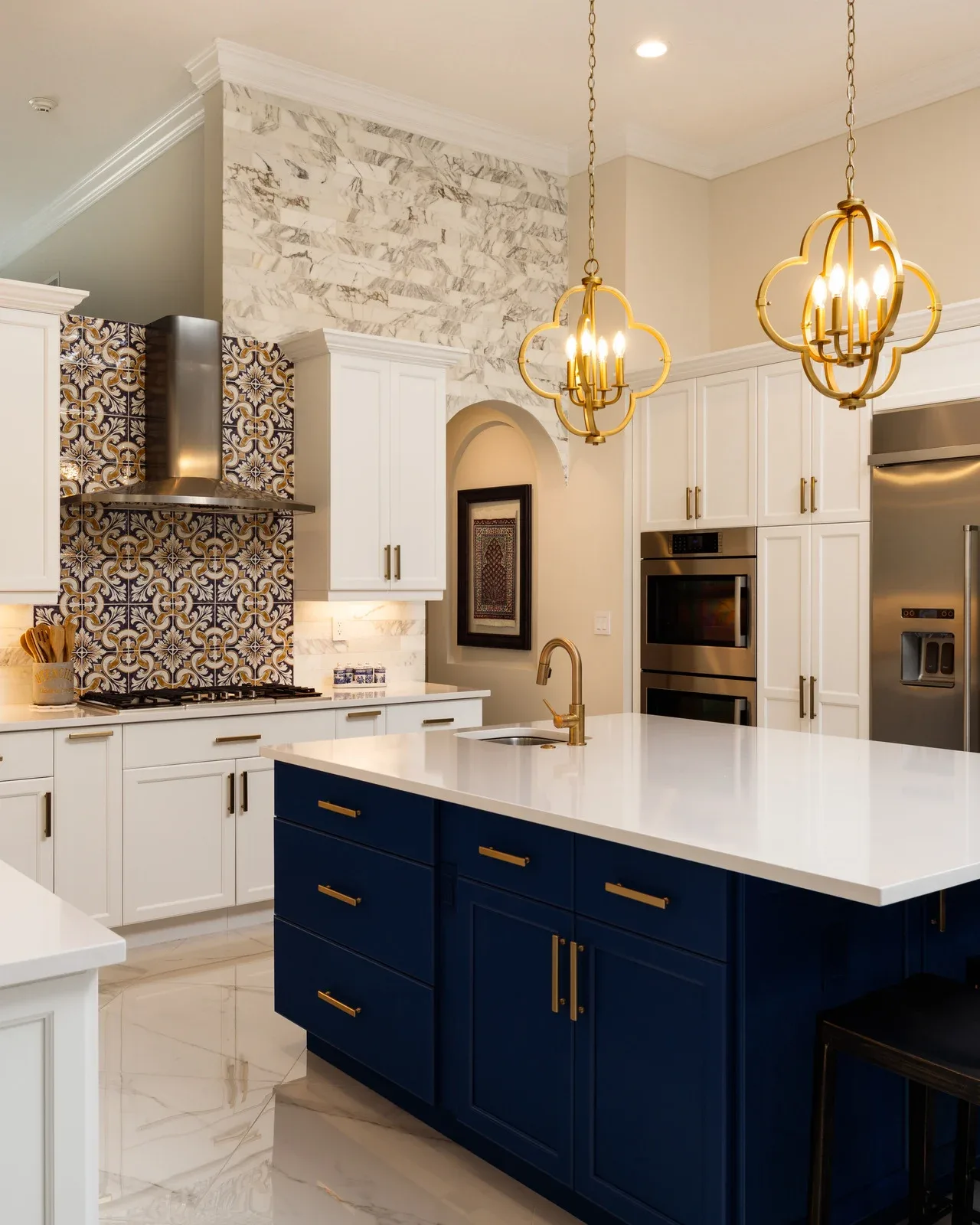 Custom kitchen remodel with navy island and brass fixtures in Fort Worth